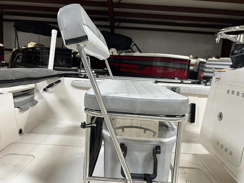 Slide: The Image of 2025 Carolina Skiff 21 LS boat interior with cushioned seating and storage. - 11