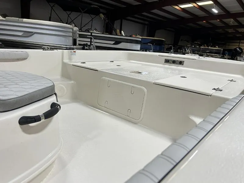Slide: The Image of 2025 Carolina Skiff 21 LS boat interior with seating and storage compartments. - 12