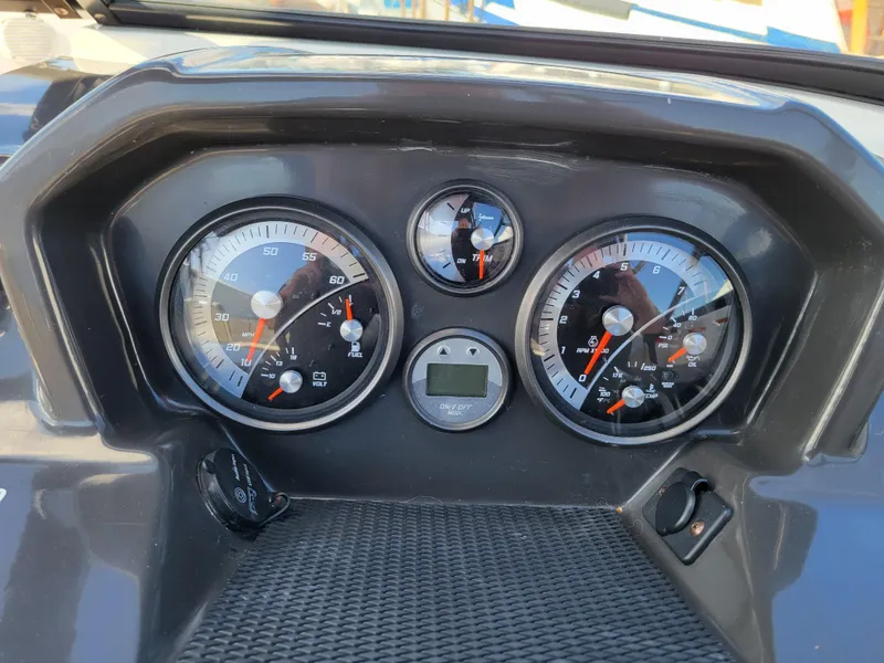 Slide: The Image of Dashboard of 2019 Bayliner VR6 Bowrider I/O with gauges and controls. - 16