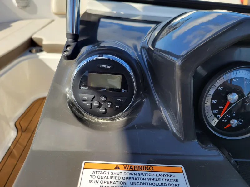 Slide: The Image of Control panel of 2019 Bayliner VR6 Bowrider I/O with Jensen stereo and warning label. - 17