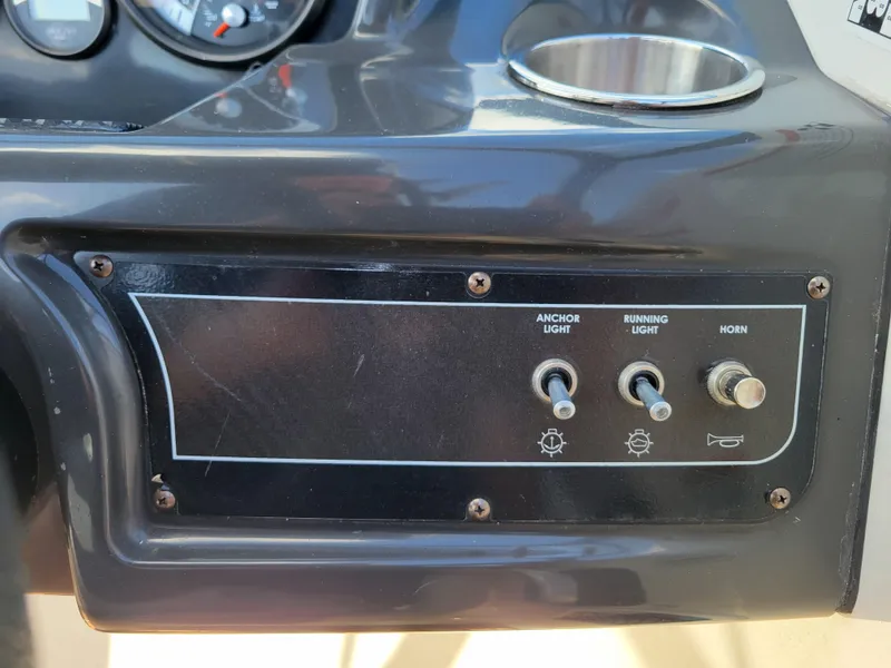 Slide: The Image of Control panel of 2019 Bayliner VR6 Bowrider I/O with switches for anchor light, running light, and horn. - 19