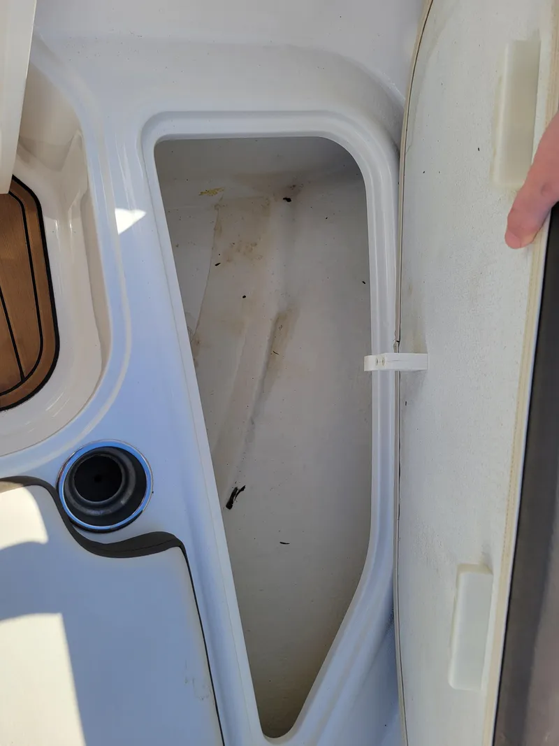 Slide: The Image of Open storage compartment on 2019 Bayliner VR6 Bowrider I/O boat. - 25