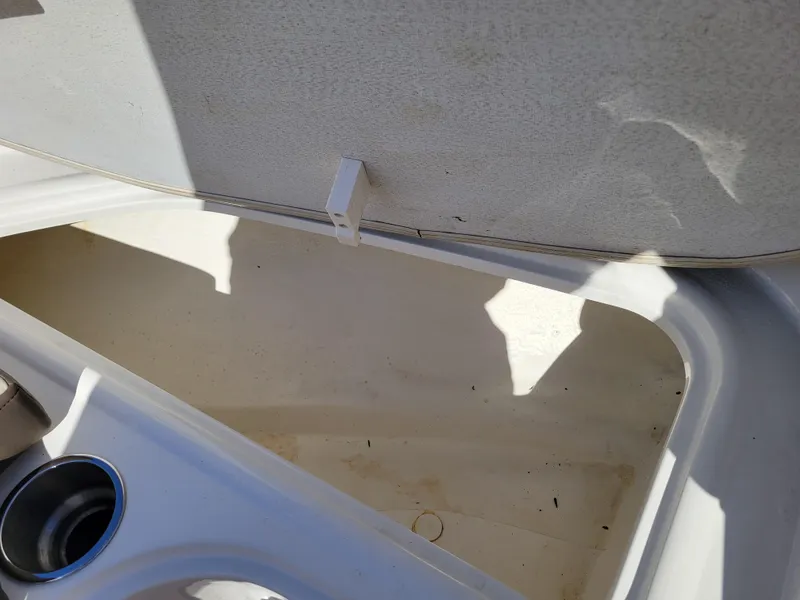 Slide: The Image of Open storage compartment on a 2019 Bayliner VR6 Bowrider I/O boat. - 27