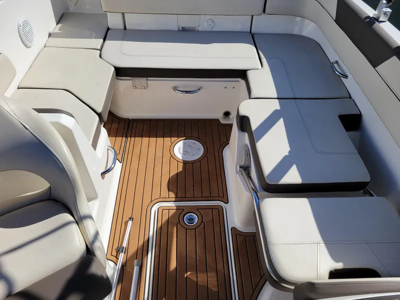 Slide: The Image of 2019 Bayliner VR6 Bowrider I/O interior with cushioned seating and teak-style flooring. - 29