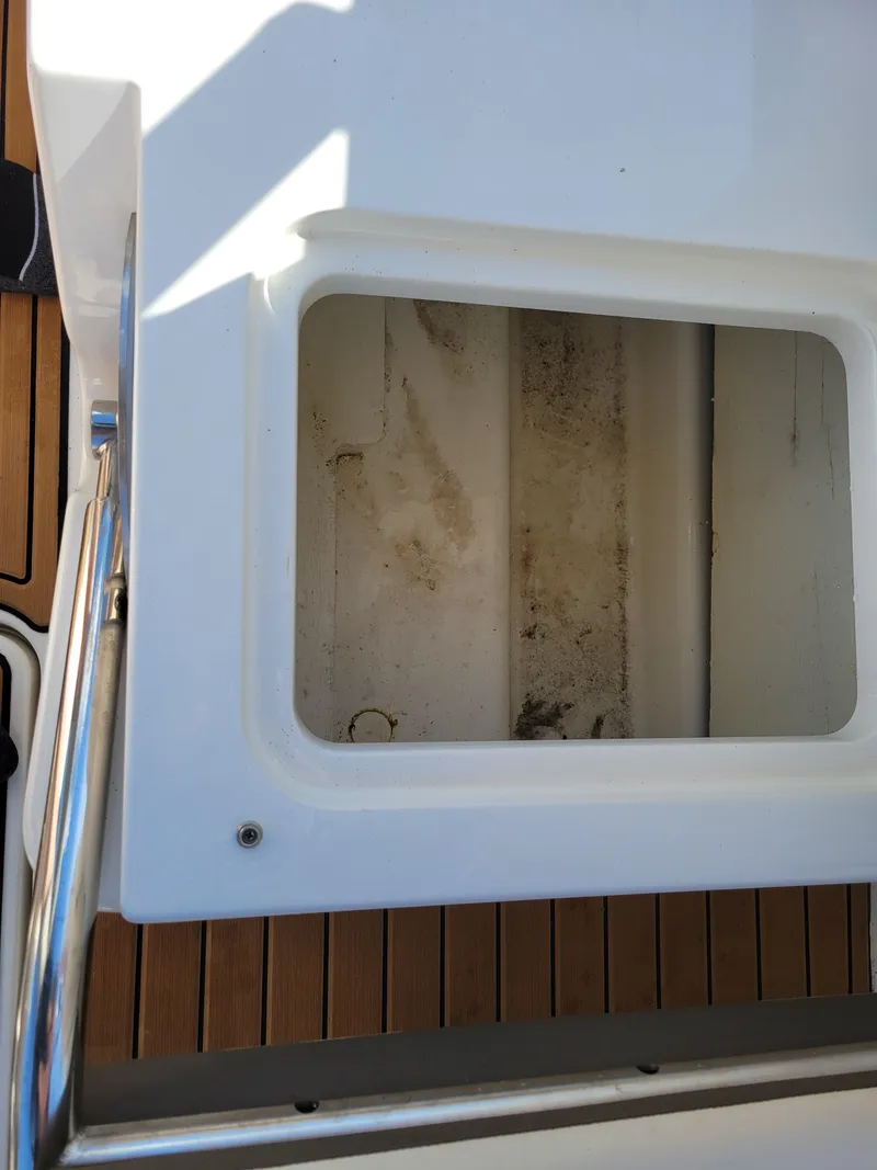 Slide: The Image of 2019 Bayliner VR6 Bowrider I/O storage compartment with teak flooring. - 32