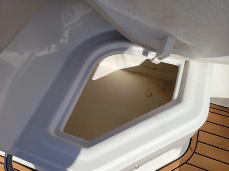 Slide: The Image of Storage compartment on 2019 Bayliner VR6 Bowrider I/O boat with teak flooring. - 35