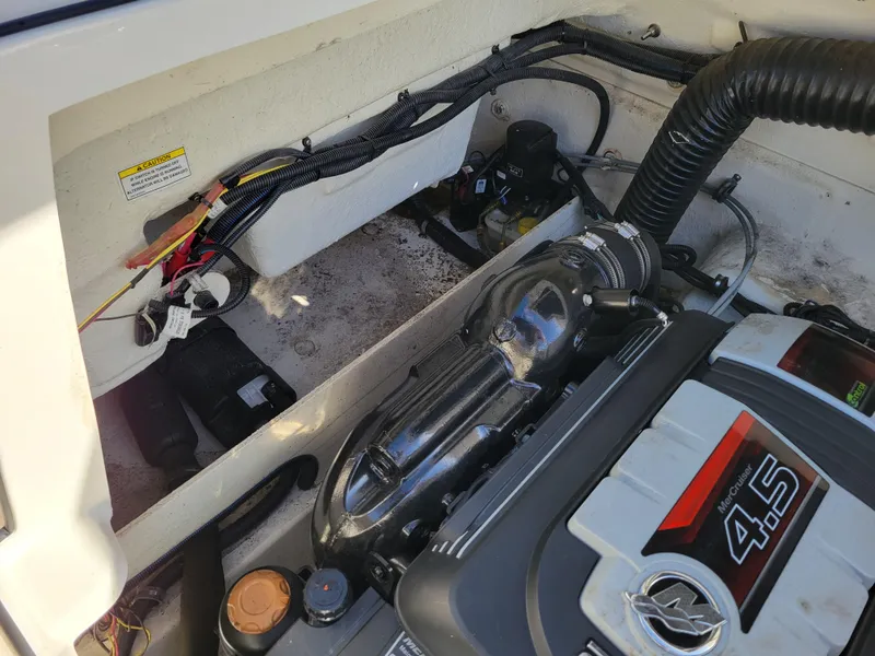 Slide: The Image of Engine compartment of a 2019 Bayliner VR6 Bowrider I/O boat. - 38