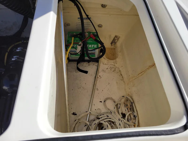 Slide: The Image of 2019 Bayliner VR6 Bowrider I/O battery compartment with cables and equipment. - 39