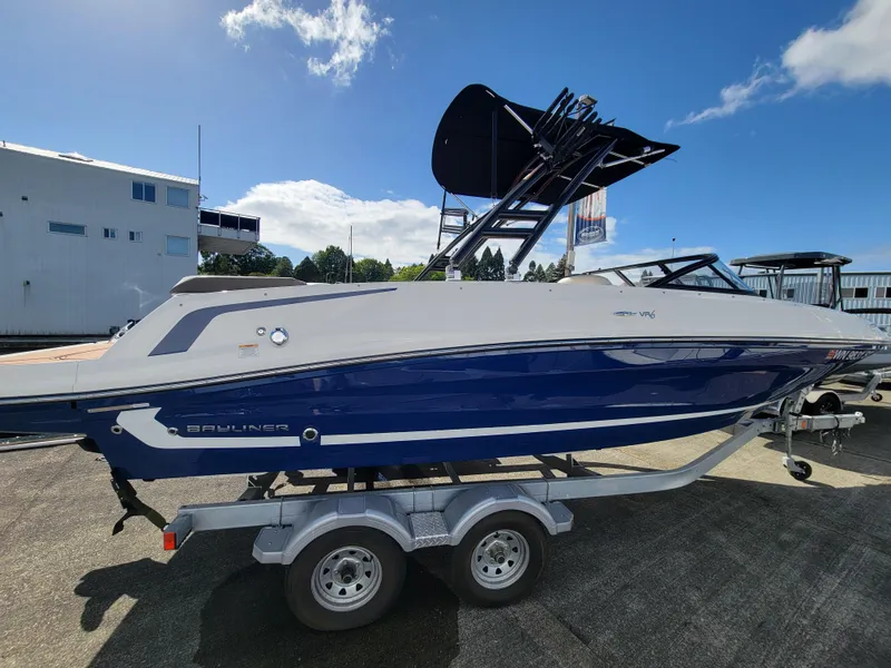 Slide: The Image of 2019 Bayliner VR6 Bowrider I/O on trailer, blue and white, sunny day. - 5