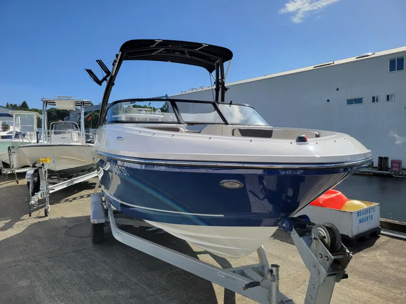 Slide: The Image of 2019 Bayliner VR6 Bowrider I/O boat on trailer, dockside view. - 6