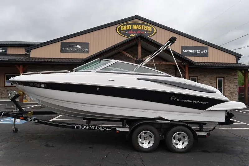 The Image of 2008 Crownline 21LS boat on trailer outside dealership. - 1