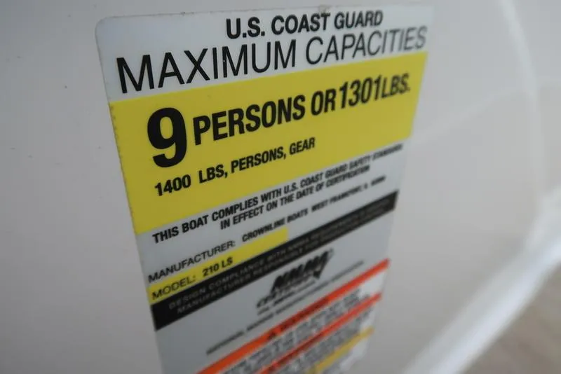 Slide: The Image of 2008 Crownline 21LS boat capacity label, 9 persons or 1301 lbs, U.S. Coast Guard compliant. - 19