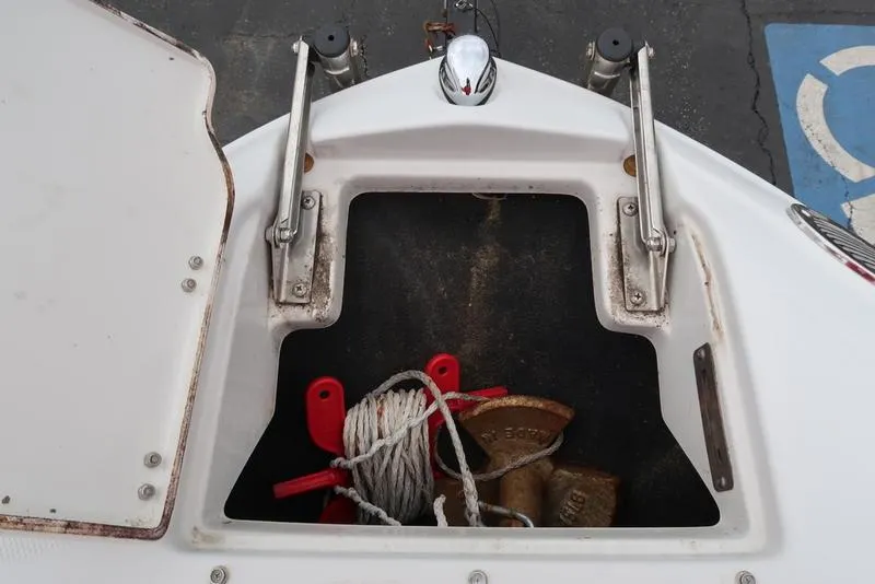 Slide: The Image of Open storage compartment on 2008 Crownline 21LS boat with anchor and rope. - 20