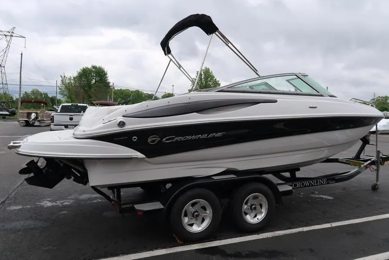 Slide: The Image of 2008 Crownline 21LS boat on trailer, parked outdoors, side view. - 5