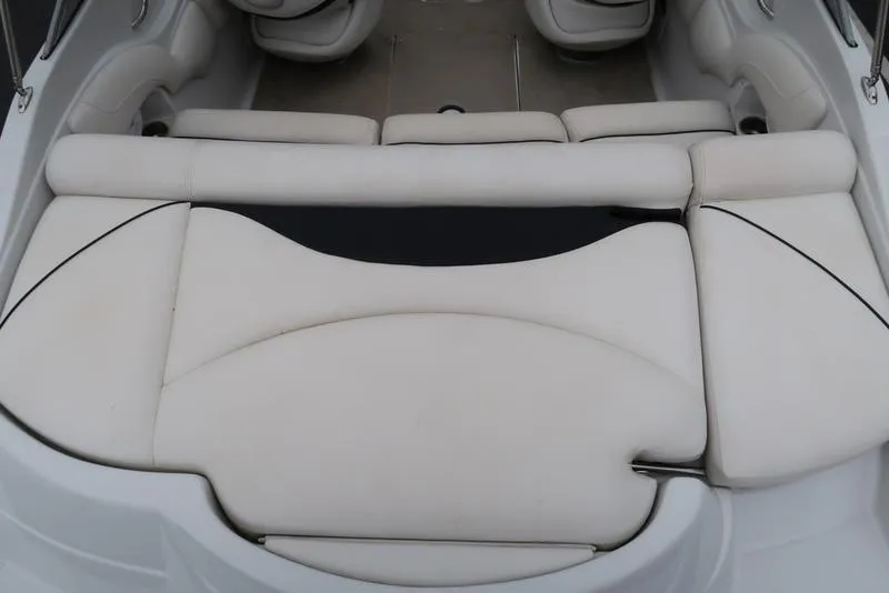 Slide: The Image of 2008 Crownline 21LS boat interior with white cushioned seating. - 7