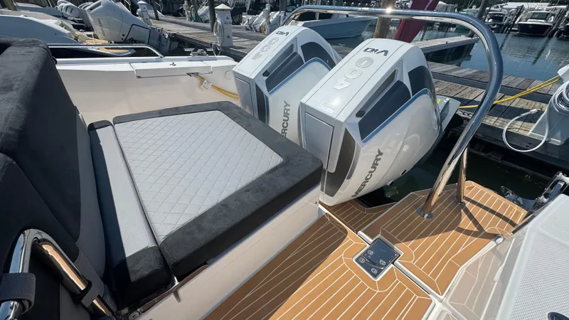 Slide: The Image of Luxury Nimbus T11 boat with dual Mercury outboard engines, 2025 model, docked at marina. - 13