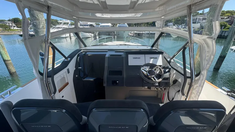 Slide: The Image of Interior view of 2025 Nimbus T11 boat cockpit with modern steering and controls. - 21