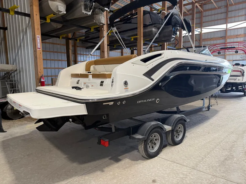 Slide: The Image of 2021 Bayliner DX2250 boat on trailer in storage facility. - 3
