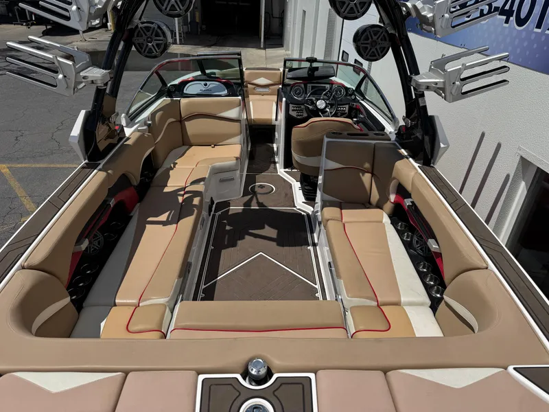 Slide: The Image of 2017 Supra SE 550 boat interior with beige seating and advanced audio system. - 5