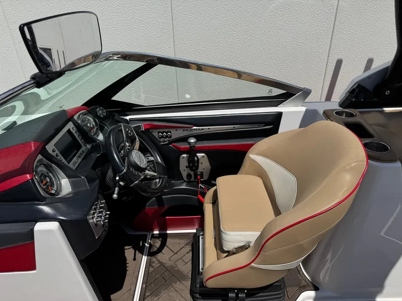 Slide: The Image of 2017 Supra SE 550 boat interior with steering wheel and captain's seat. - 7