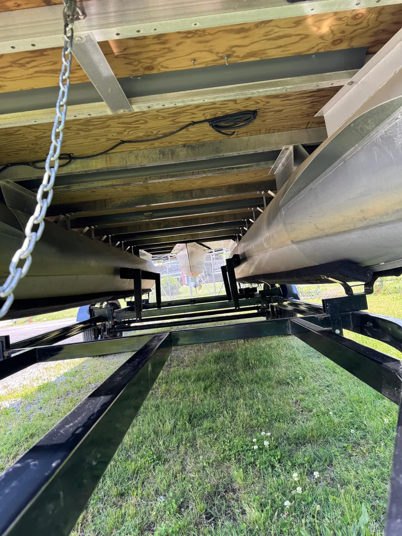 Slide: The Image of Underneath view of a 2018 Bennington 22 SLX pontoon boat on a trailer. - 2