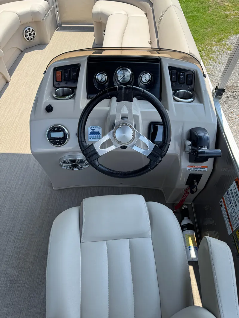 Slide: The Image of 2018 Bennington 22 SLX boat dashboard with steering wheel and controls. - 5