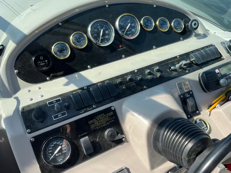 Slide: The Image of Dashboard of 2001 Cruisers Yachts 2870 Express with gauges and controls. - 14