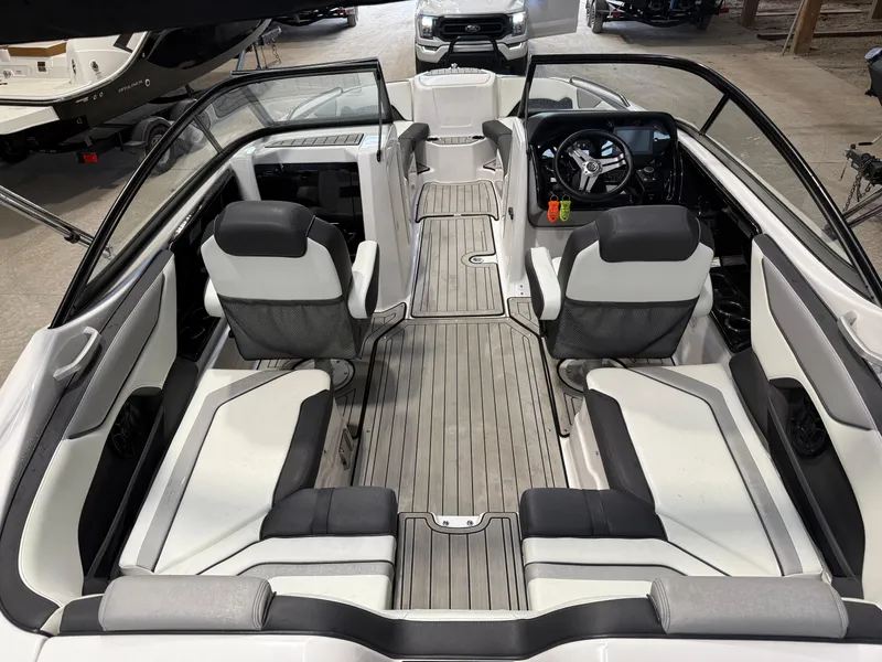 Slide: The Image of 2020 Yamaha Boats 212 interior with sleek seating and modern dashboard design. - 3