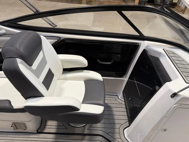 Slide: The Image of 2020 Yamaha Boats 212 interior with sleek black and white seating and modern design. - 5