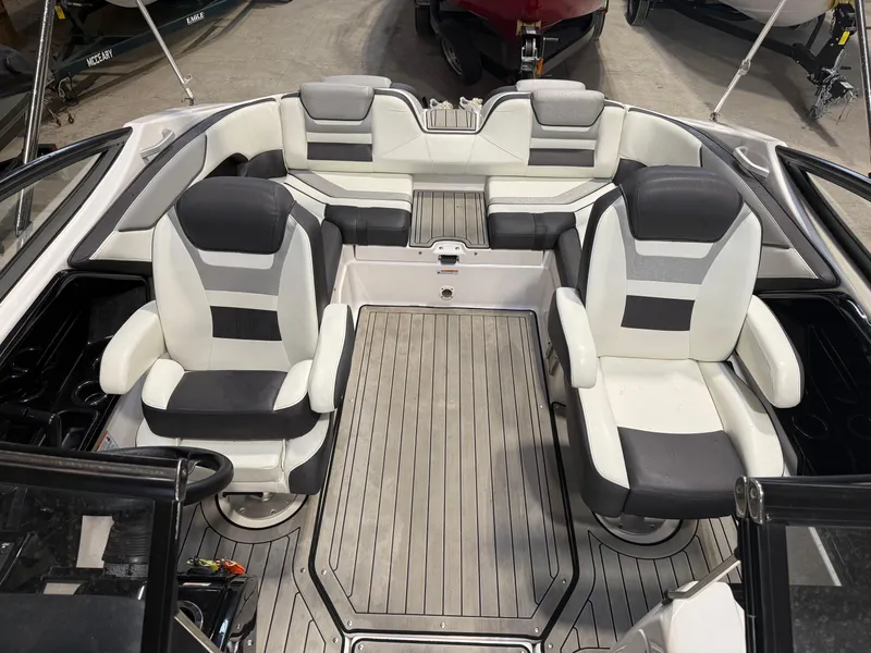 Slide: The Image of 2020 Yamaha Boats 212 interior with sleek seating and modern design. - 7