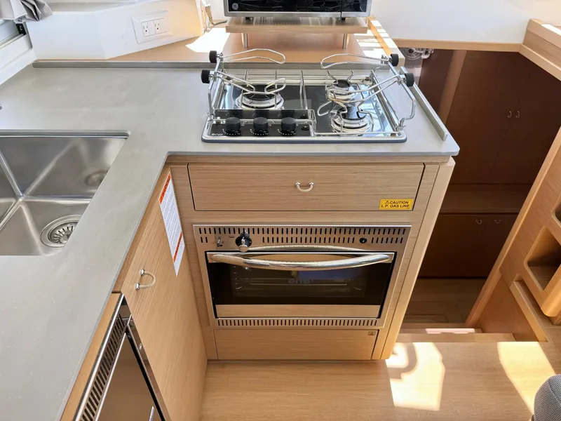 Slide: The Image of Modern kitchen in 2023 Excess 12 yacht with stove, oven, and sink. - 15