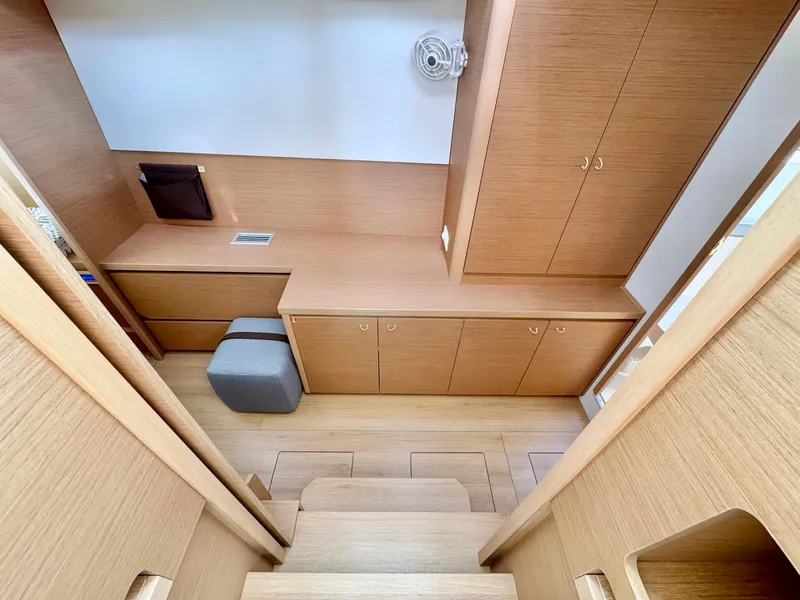 Slide: The Image of Interior of 2023 Excess 12 yacht, featuring wooden cabinetry and modern design elements. - 18