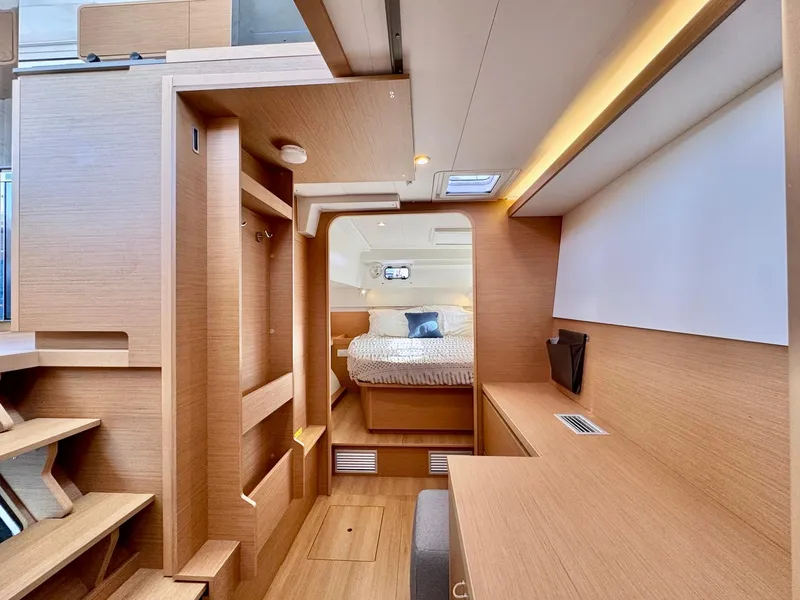 Slide: The Image of Luxurious interior of 2023 Excess 12 yacht with modern wood finish and cozy bedroom. - 20