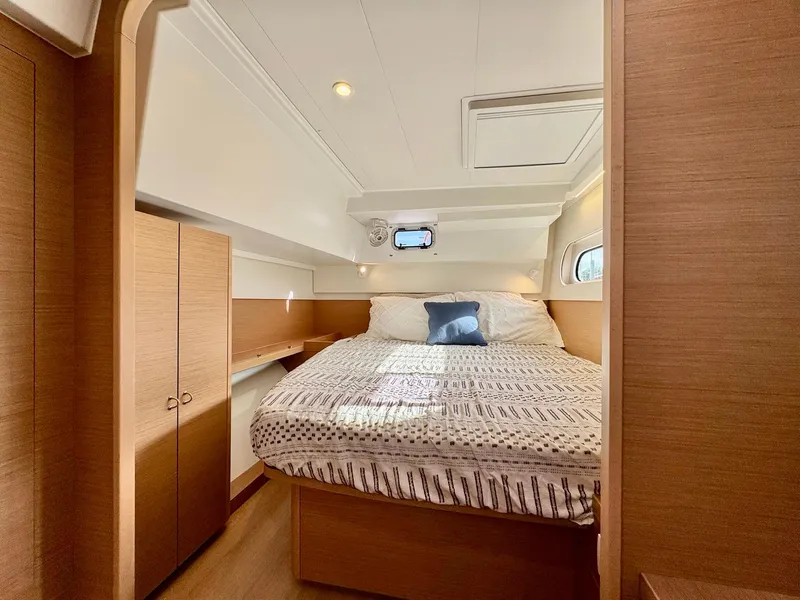 Slide: The Image of Luxurious cabin interior of 2023 Excess 12 yacht with cozy bed and wooden finishes. - 21