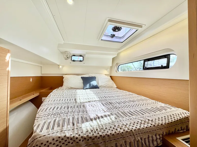 Slide: The Image of Luxurious cabin interior of 2023 Excess 12 yacht with cozy bed and natural light. - 22