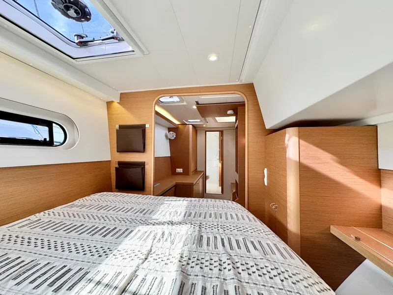 Slide: The Image of Luxurious interior of 2023 Excess 12 yacht cabin with modern design and natural light. - 23