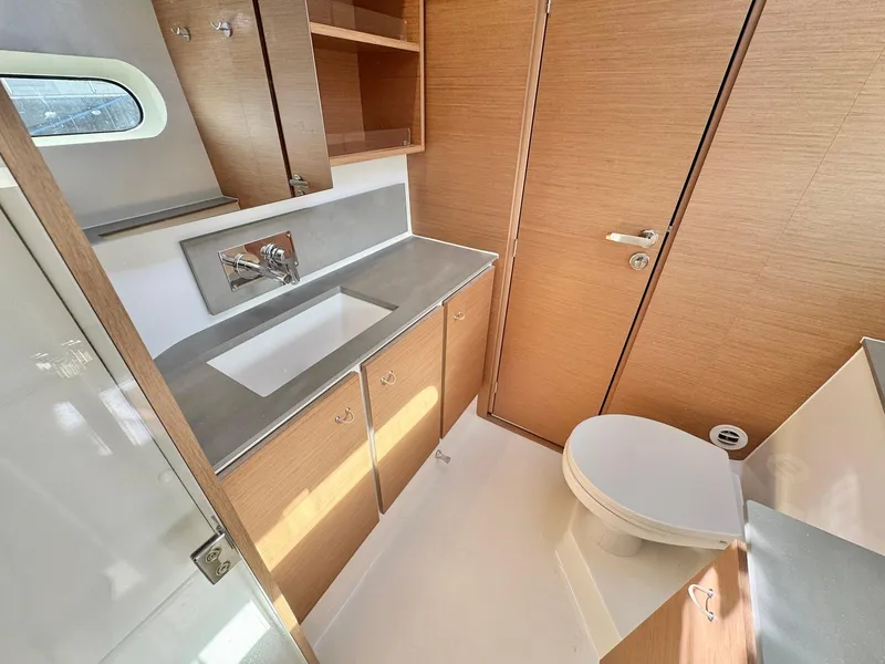 Slide: The Image of Modern bathroom in 2023 Excess 12 yacht with sleek fixtures and wooden cabinetry. - 32