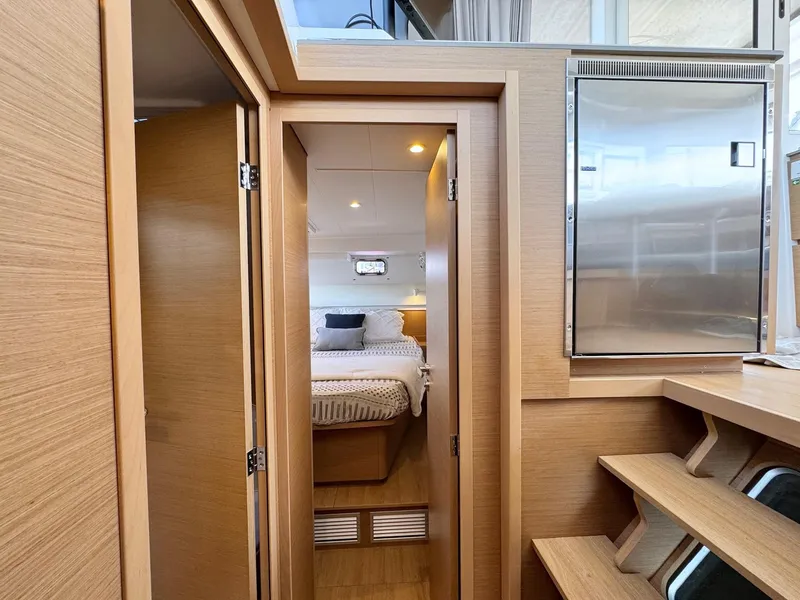Slide: The Image of Modern interior of 2023 Excess 12 yacht with cozy bedroom and wooden finishes. - 34
