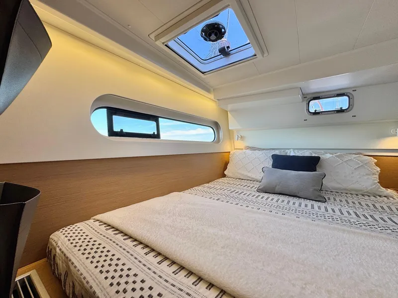 Slide: The Image of Luxurious cabin interior of 2023 Excess 12 yacht with cozy bedding and skylight. - 39