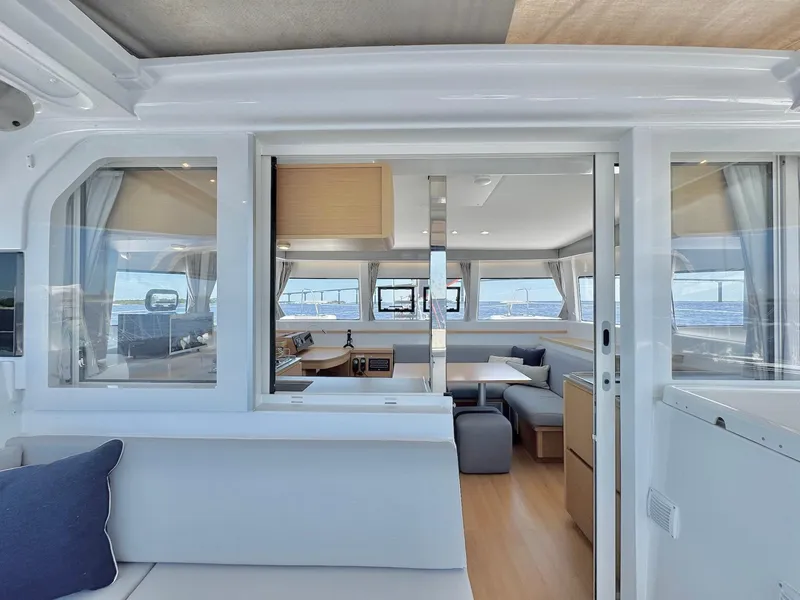 Slide: The Image of Modern interior of 2023 Excess 12 catamaran with spacious seating and panoramic windows. - 4