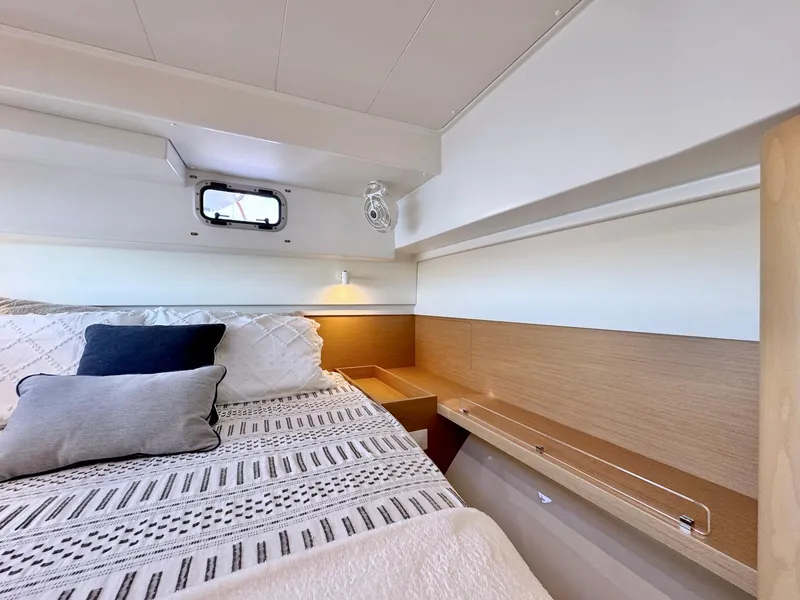 Slide: The Image of Cozy cabin interior of 2023 Excess 12 yacht with stylish bedding and ambient lighting. - 40