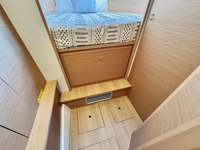 Slide: The Image of Cozy cabin interior of 2023 Excess 12 yacht with wooden finish and bed. - 48
