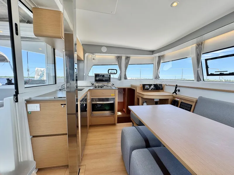 Slide: The Image of Modern interior of 2023 Excess 12 yacht with kitchen and dining area. - 5