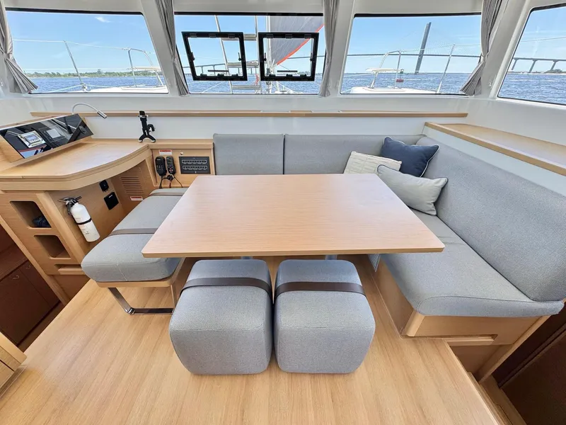 Slide: The Image of Modern interior of 2023 Excess 12 catamaran with dining area and panoramic windows. - 6