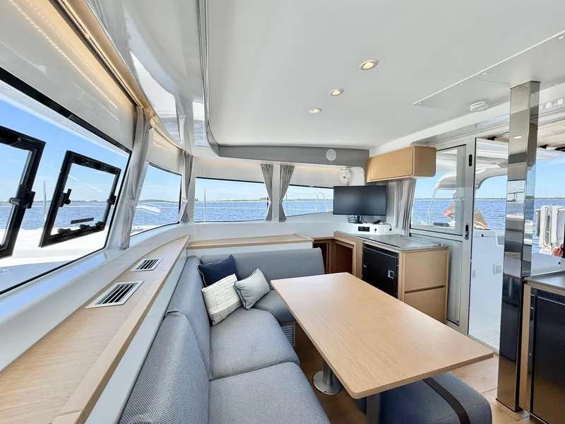 Slide: The Image of Luxurious interior of 2023 Excess 12 yacht with modern seating and ocean view. - 7