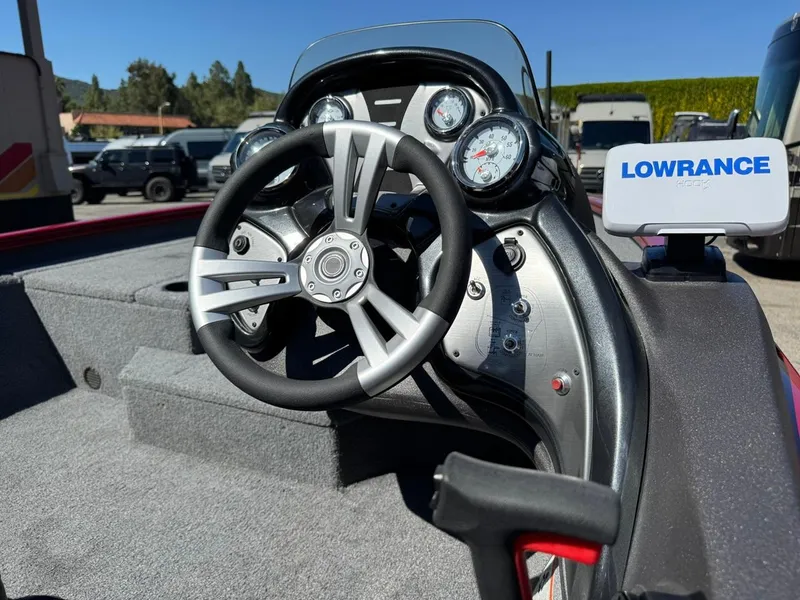 Slide: The Image of 2022 Tracker PRO TEAM 175 TWX boat dashboard with steering wheel and Lowrance display. - 15