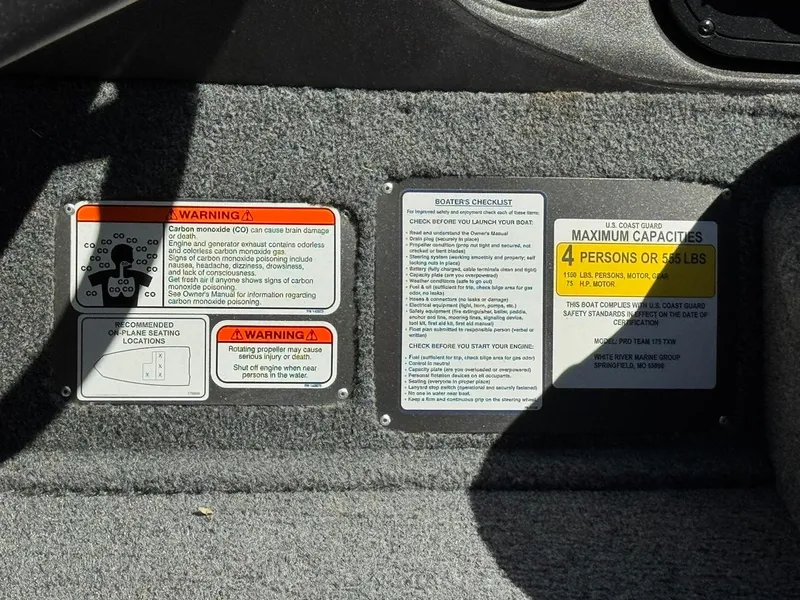 Slide: The Image of Warning and capacity labels on 2022 Tracker PRO TEAM 175 TWX boat interior. - 16