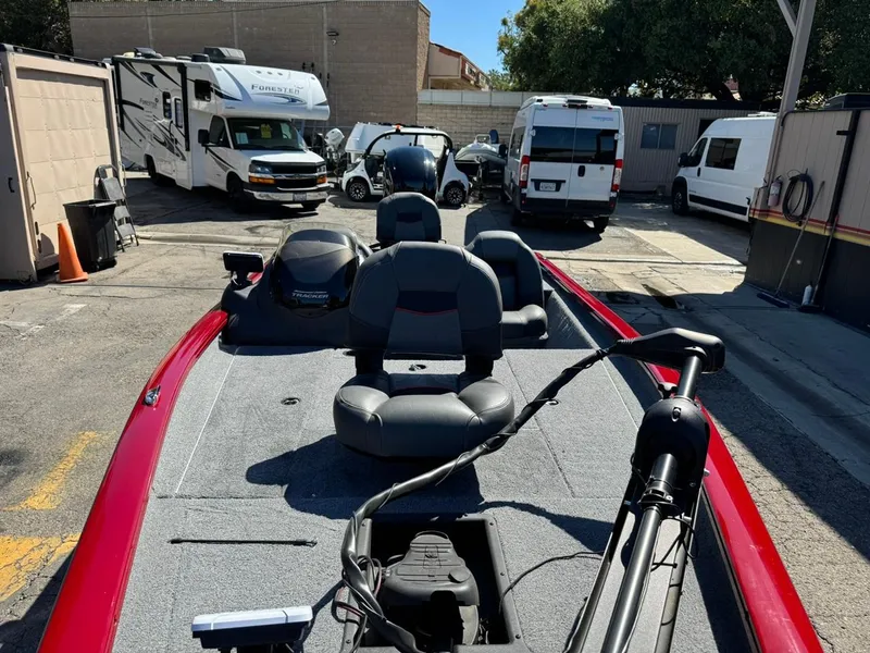 Slide: The Image of 2022 Tracker PRO TEAM 175 TWX boat in parking lot with RVs and vans. - 17