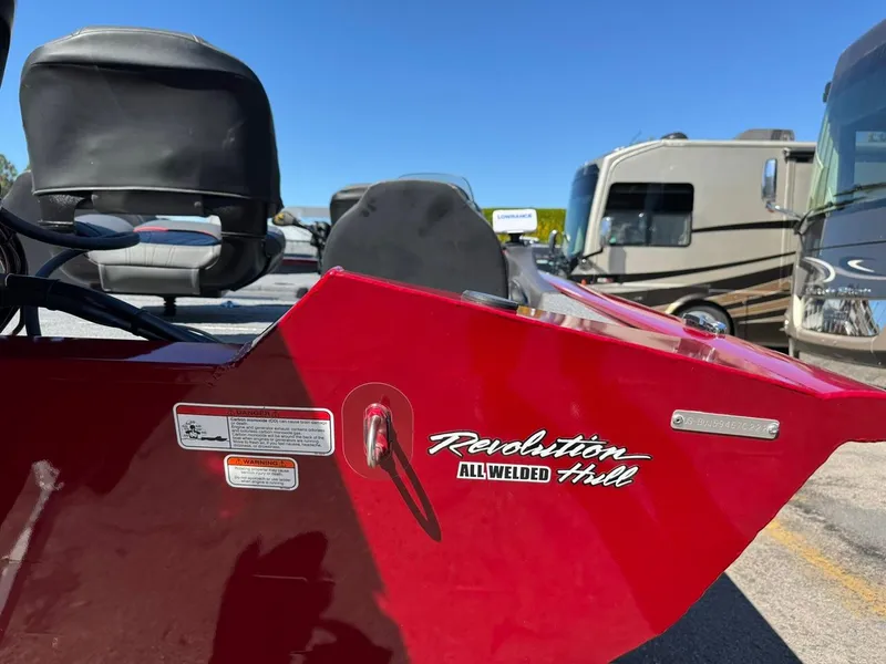 Slide: The Image of Red 2022 Tracker PRO TEAM 175 TWX boat with Revolution all-welded hull, parked near RVs. - 20