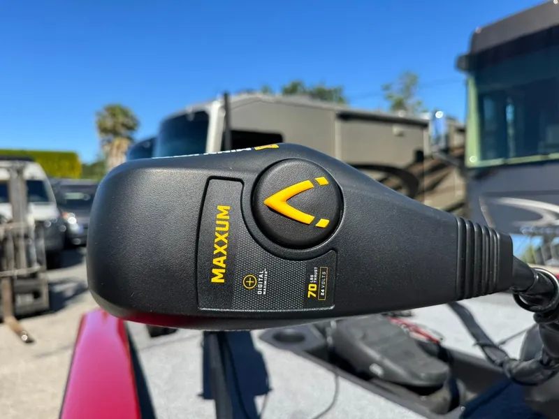 Slide: The Image of Trolling motor control on 2022 Tracker PRO TEAM 175 TWX boat, sunny day background. - 9